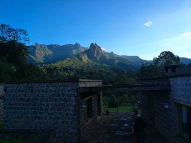 Bale Mountain Lodge in foreground with mountain and blue sky in background